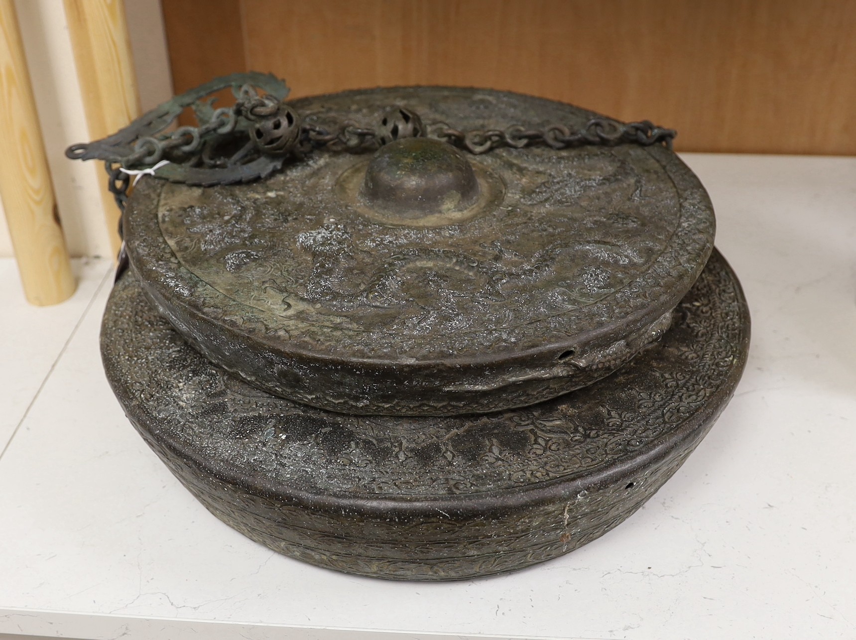Two 19th century Borneo bronze gongs, Tawak-Tawak, largest 42cm diameter